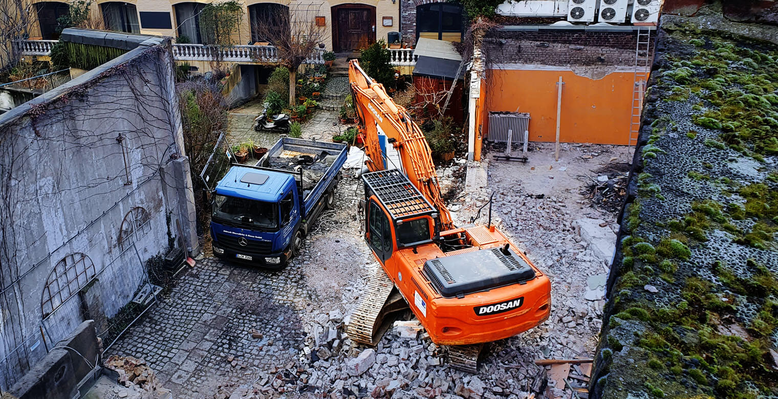 Demolition of a house with an excavator